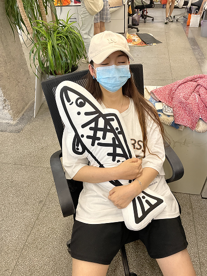 Resting at the studio with a plush cushion