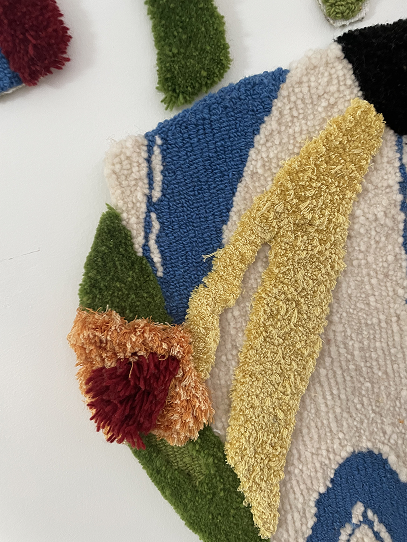 Close-up of tufted textile craft work